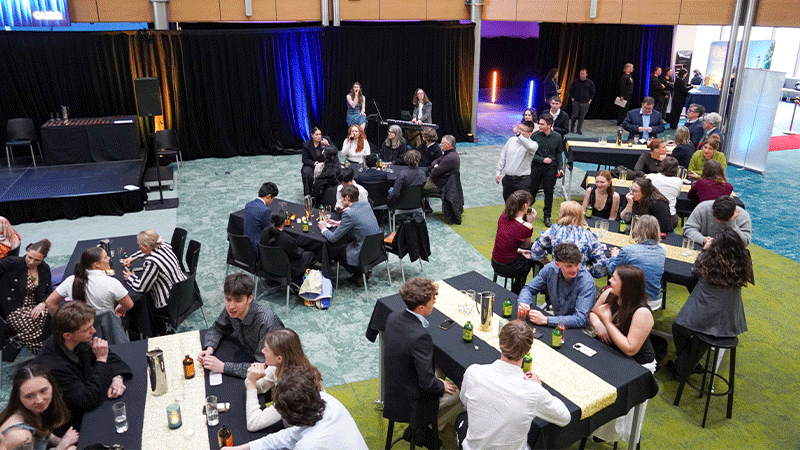 people sitting at tables during event