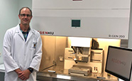 Prof Tim Woodfield with RegenHU bioprinter thumbnail