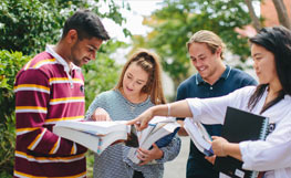 University of Otago students having a discussion on the Dunedin Campus. Image.