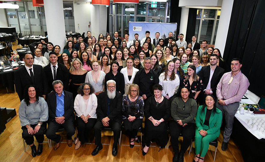 Group photo of Maori graduates and staff and Maori pre-graduation ceremony dinner 2022