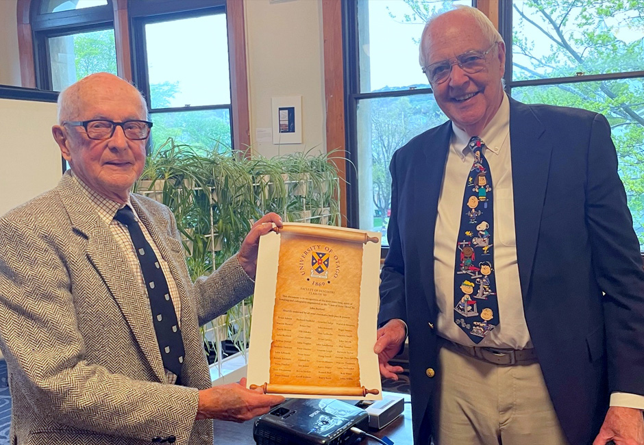 John receives a scroll to celebrate his reunion service