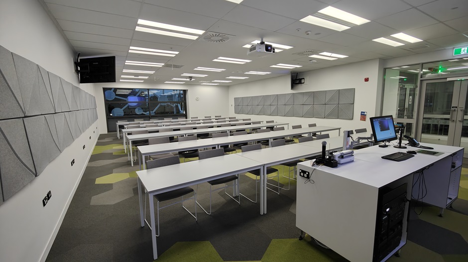 View of Mellor Laboratories room ME202, showing rows of tables and chairs