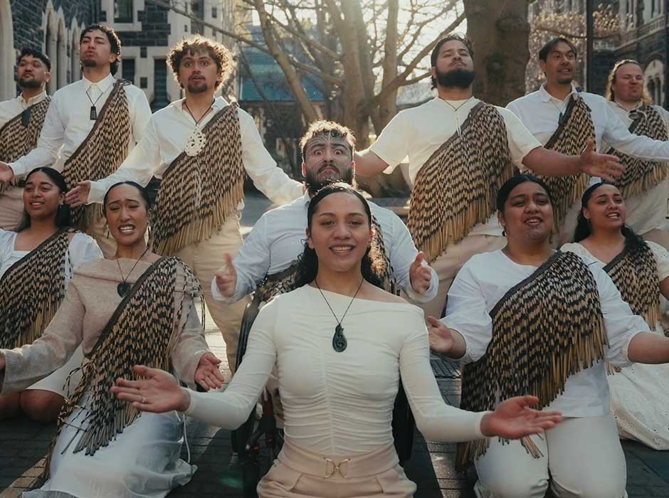 a group of people performing in the quad 
