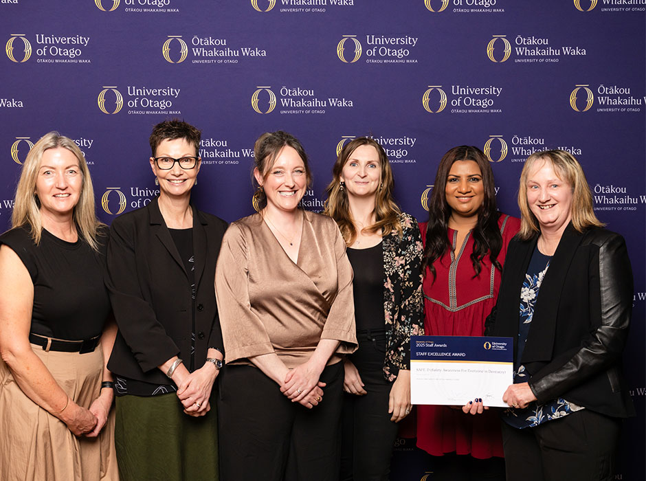 a row of women having accepted a certificate 