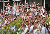 Group of people cheering in togas-thumbnail image