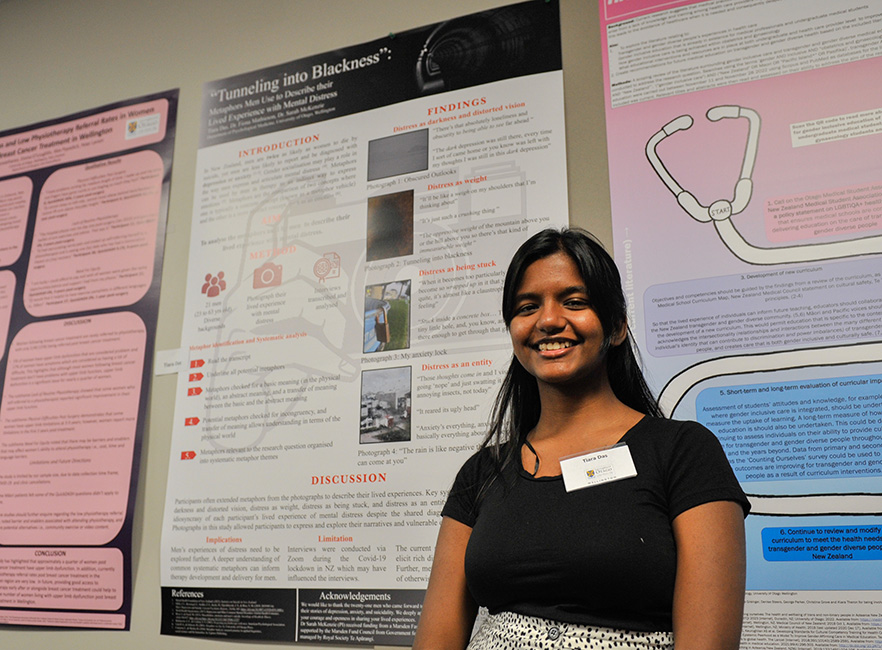 Summer students 2023  winner Tiara Das in front of poster image