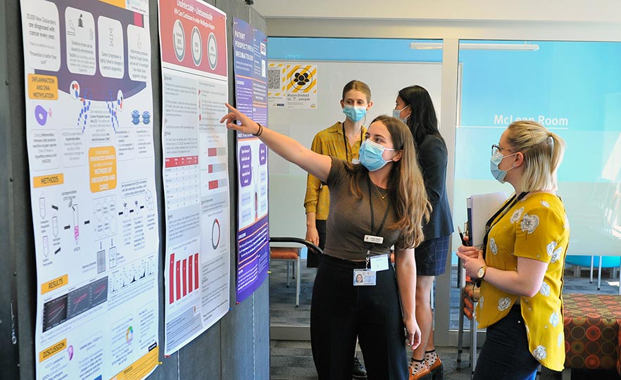 Katie Reed and Dr Kathryn Hally at the Summer Student poster showcase image