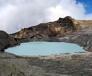 Mount Ruapehu's steaming Crater Lake surrounded by andesitic lava and tephra. The collapse of the lake rim has generated devastating lahars in the past.
