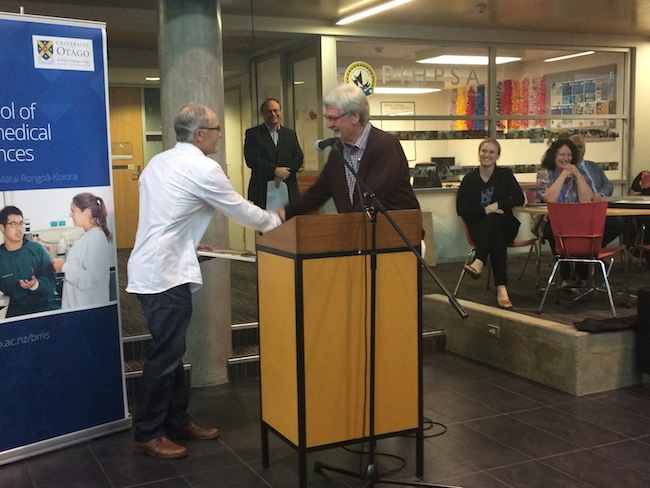 Emeritus Professor Frank Griffin receiving the Commercialisation Researcher Award by Professor Greg Cook at the Annual School of Biomedical Sciences Awards 2016