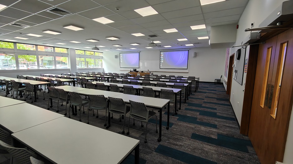View of Biochemistry seminar room BIG13, showing rows of tables and chairs