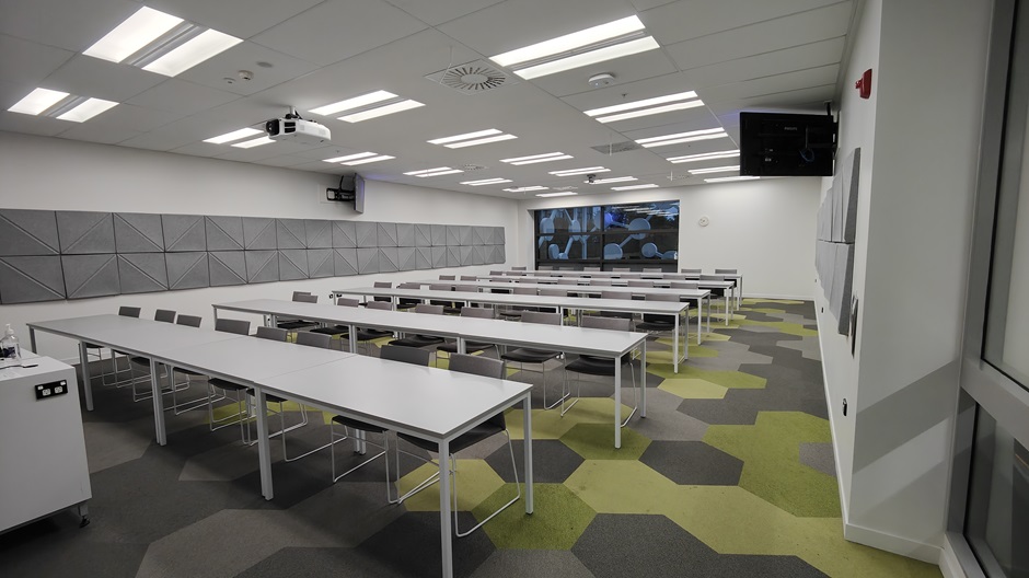 View of Mellor Laboratories room ME202, showing rows of tables and chairs