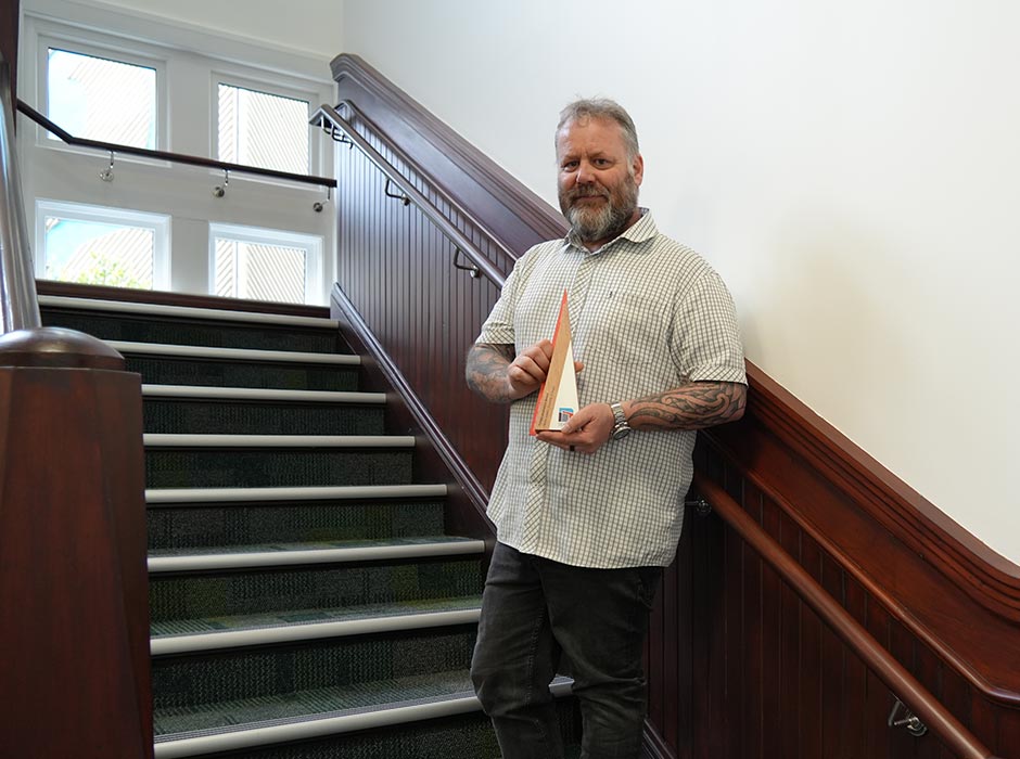 Shane-Jenkins-with-TEFMA-award trophy