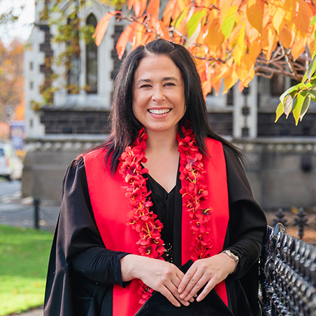 Deputy Vice-Chancellor Pacific Dianne Sika-Paotonu in academic regalia and a floral lei