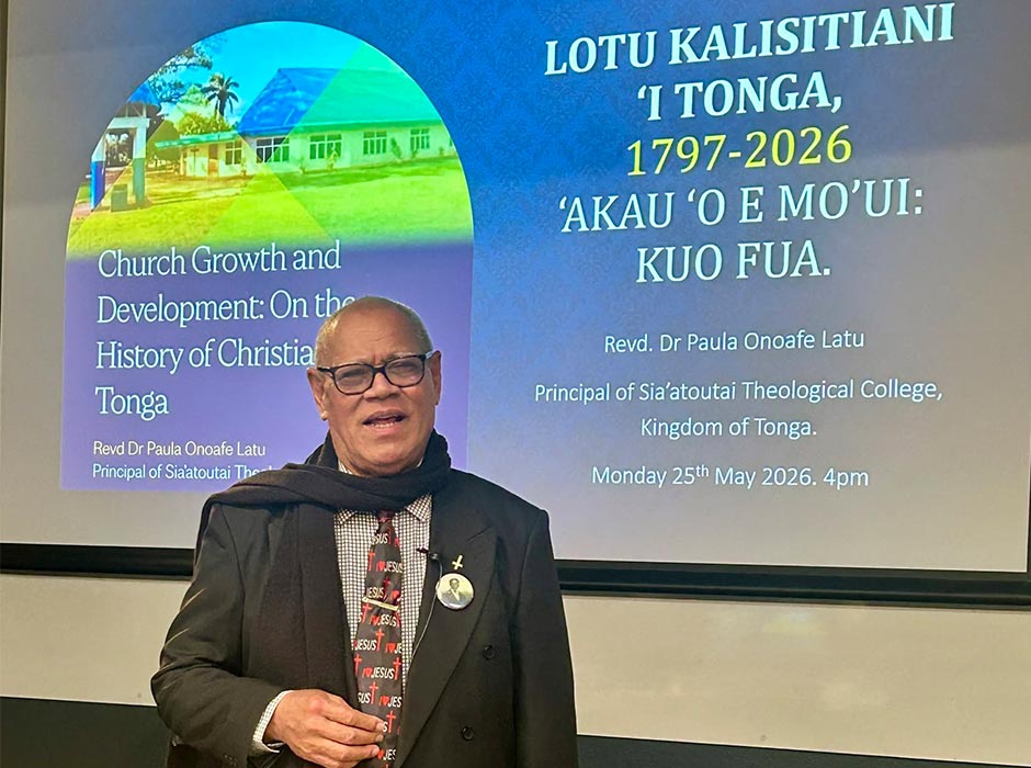 Reverend Dr Paula Onoafe Latu is pictured in front of a screen during his talk.