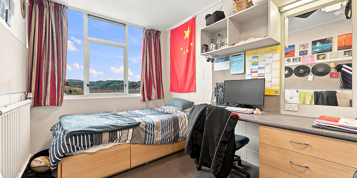 Bedroom with window view acoss Dunedn hills