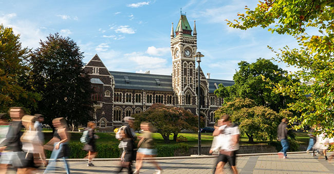 Clocktower with students walking in front thumbnail image