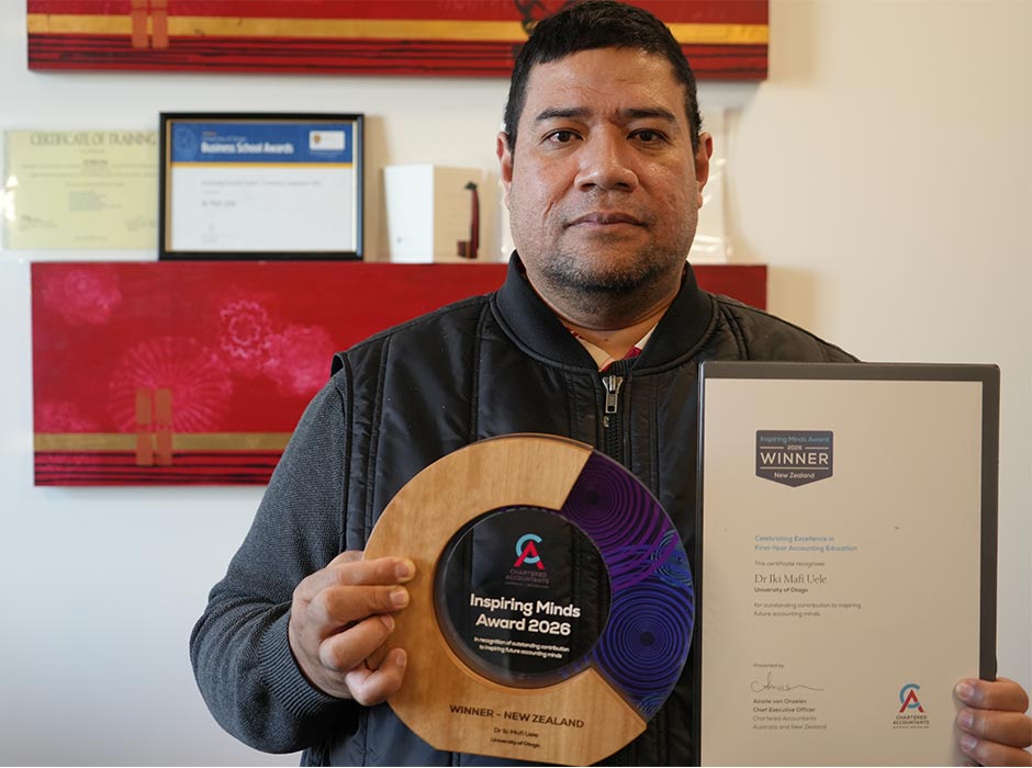 Dr Iki Mafi Uele with his award.