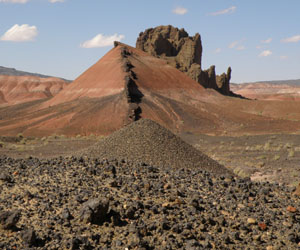 Pyroxene-crystal anthill can't compete with dike and diatreme in Painted Desert country, Hopi Buttes, Arizona, USA