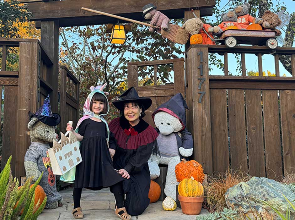 A woman and child in halloween costume 