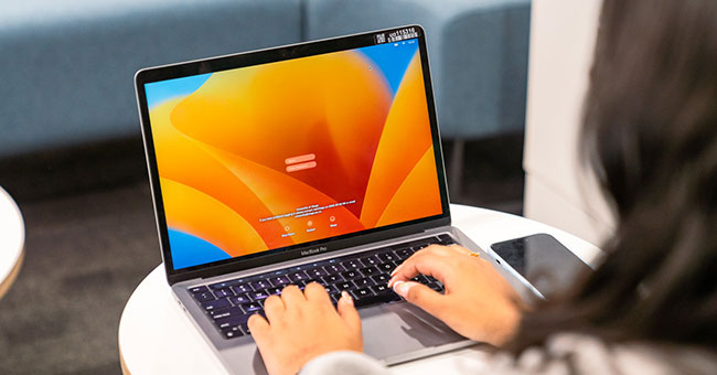 Closeup of someone using a laptop