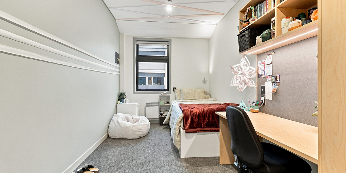 Student bedroom with desk and window