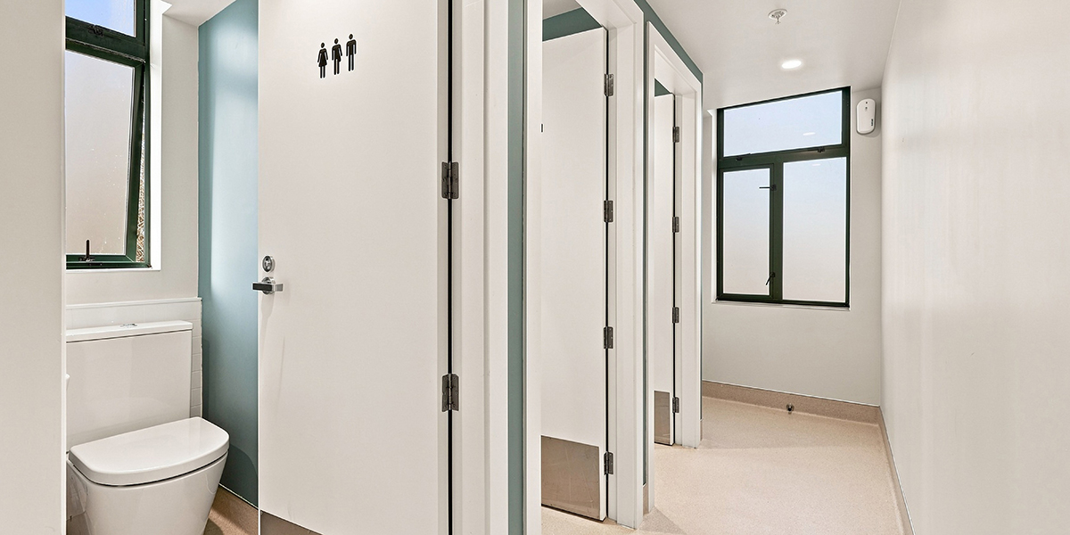 Toilet cubicles with unisex signage