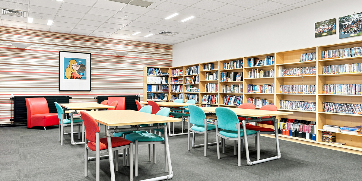 Study area with tables, and book shelves along one wall