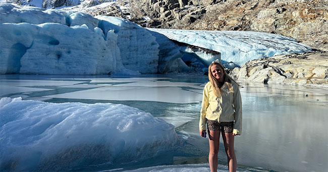 Hannah Webb, pictured in front of a glacier.
