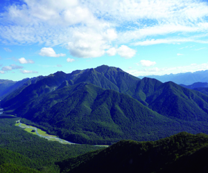 Mt. Cann (1693 m) and the mid Glenroy valley, southeast Nelson, with Victoria Range in the background (March, 2011).  The Mt. Cann range consists of mid-Cretaceous Separation Point Suite granitoids