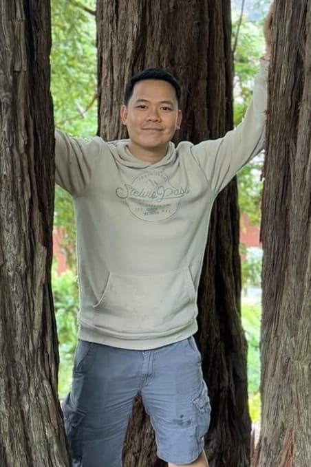 Michael Jamillion in front of trees