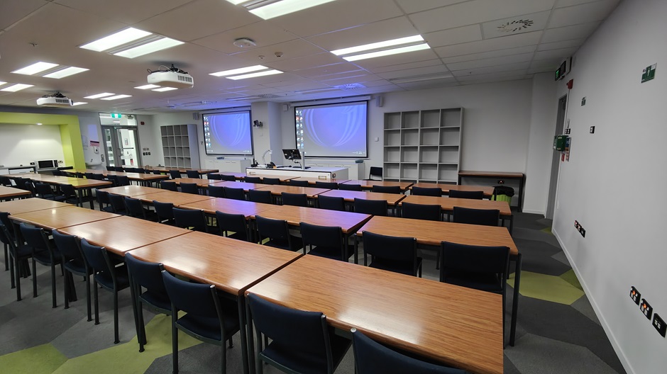 View of Mellor Laboratories room ME215, showing rows of tables and chairs