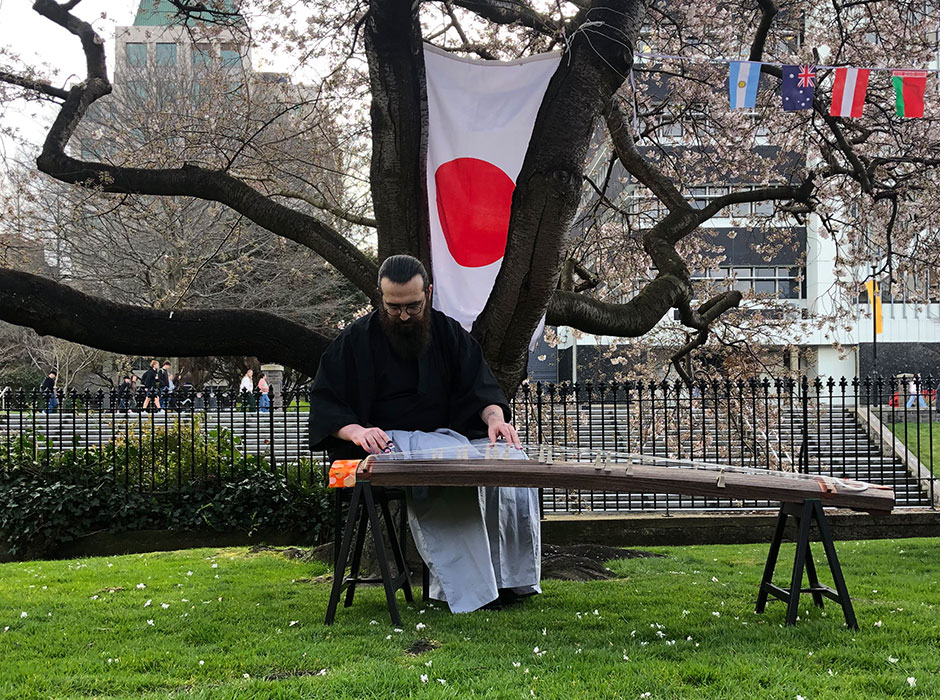 A man playing a koto 