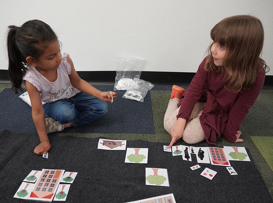 Zanaiyah Ar Rahman (4), left, and Lily Watson (6) take part in an urban design exercise. 