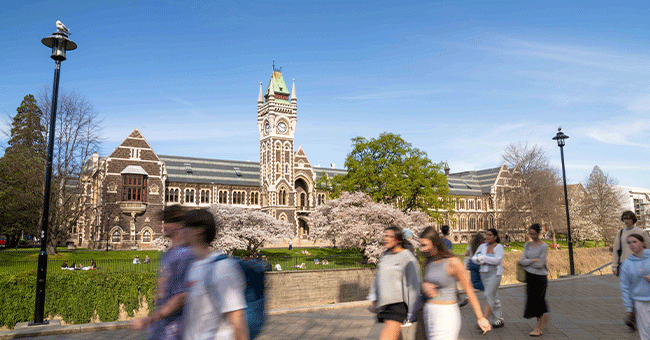 university clocktower with blurred students