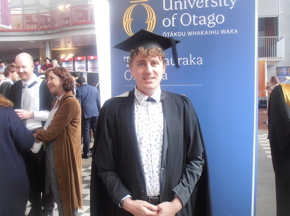 Reuben Beard, pictured in his graduation gown at the Business School.