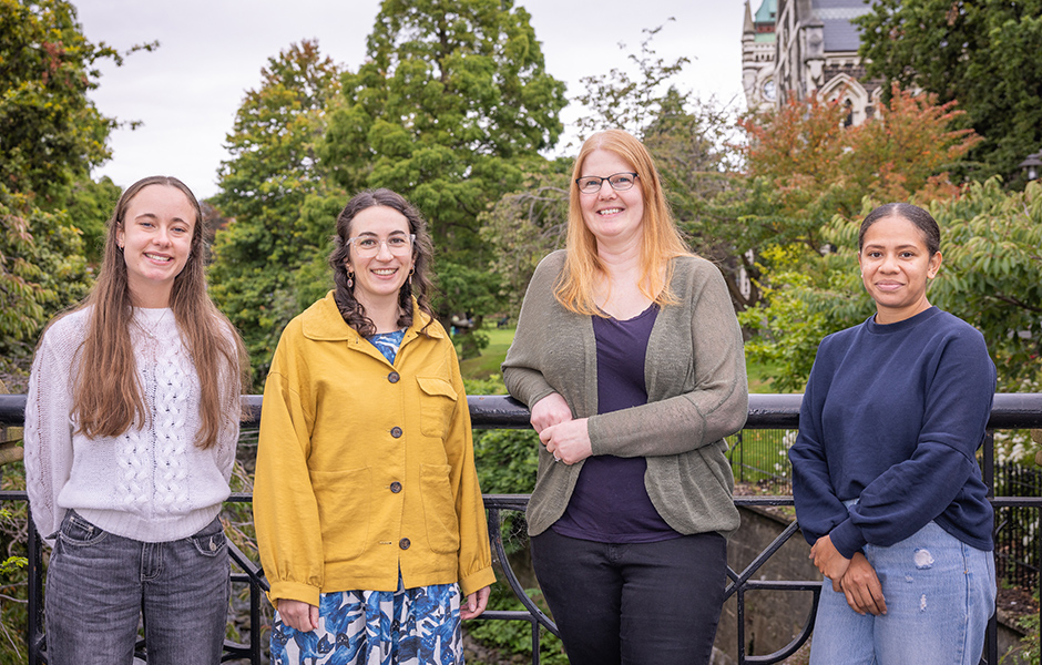Bridget Watson and 3 team members standing on a bridge.