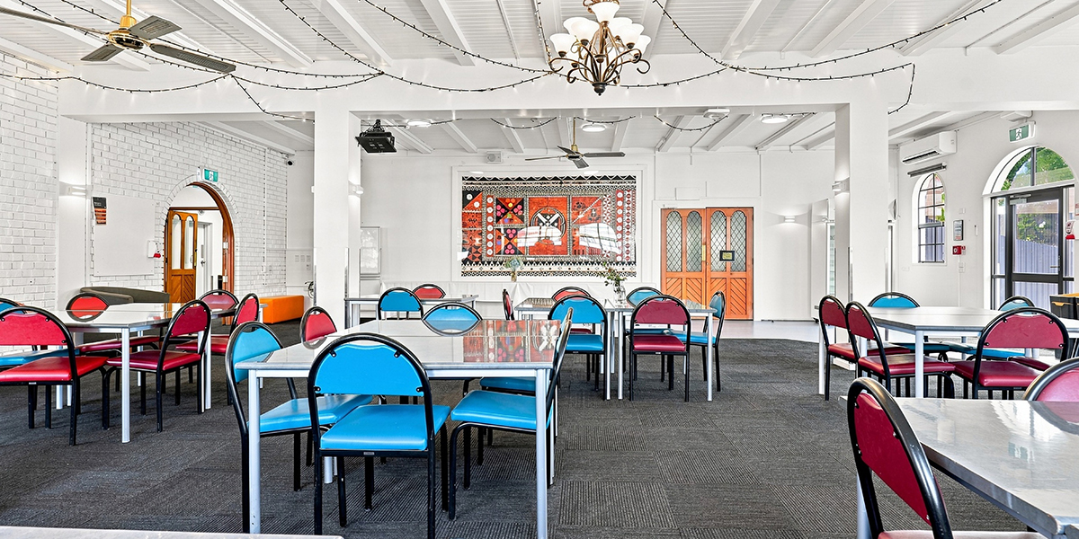Shared dining area with tables and chairs