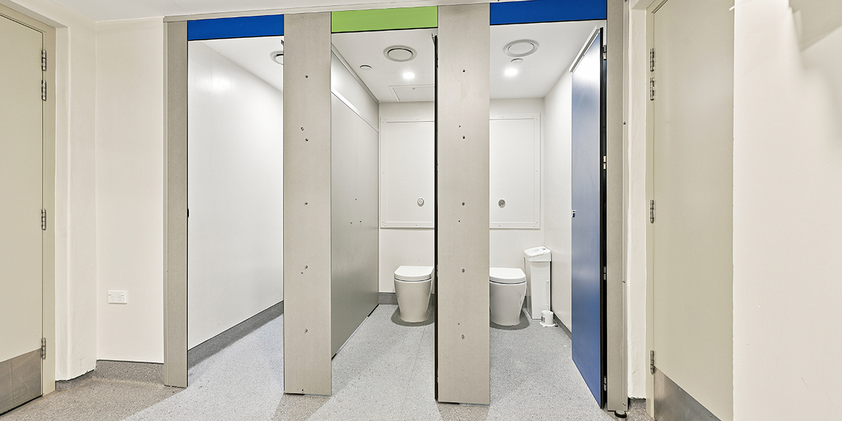 Side-by-side bathroom toilet cubicles