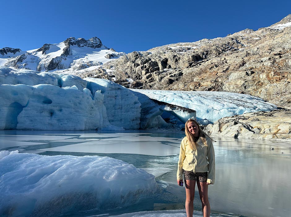 Hannah Webb, pictured in front of a glacier.