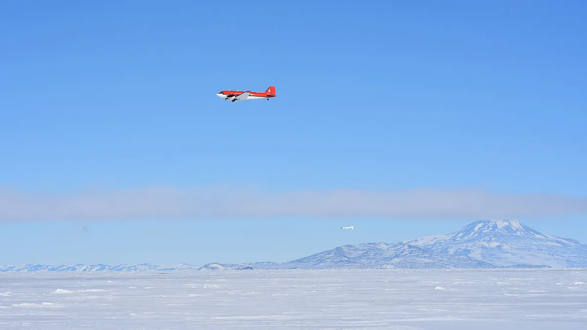 Aircraft flying over Antarctic sea ice