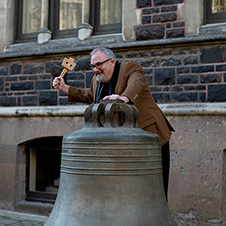 Jim Wilkes donging the bell marking the submission of his DBA 1x