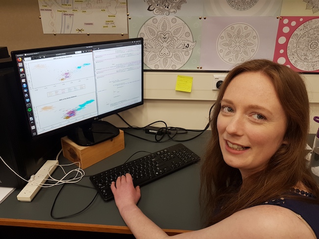 Steph McGimpsey shows some of her master's research on her computer.