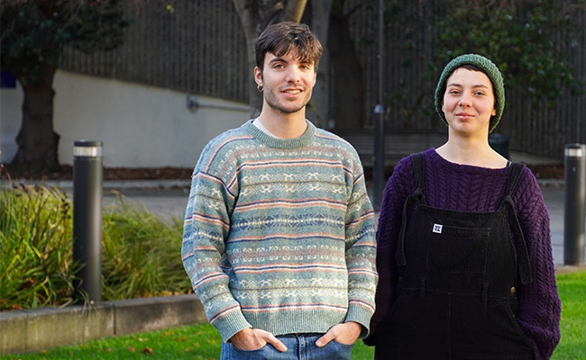 Alessandro and Helena standing on the lawn at Otago University.