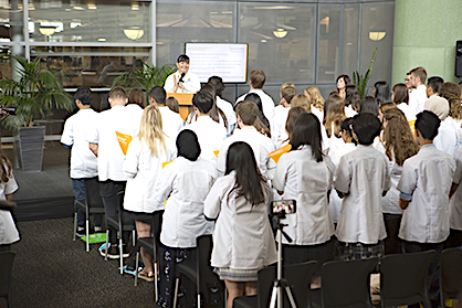 Pharmacy students read principles with Diana Phone