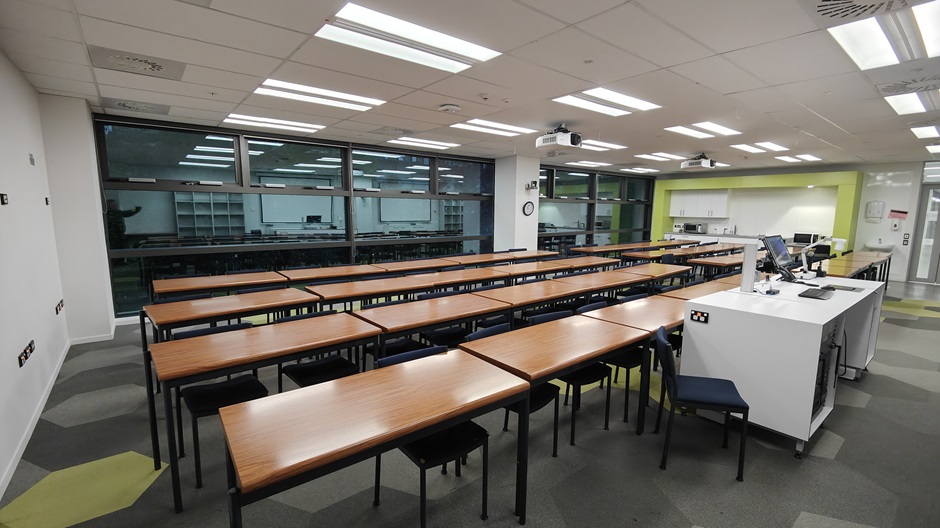 View of Mellor Laboratories room ME215, showing rows of tables and chairs