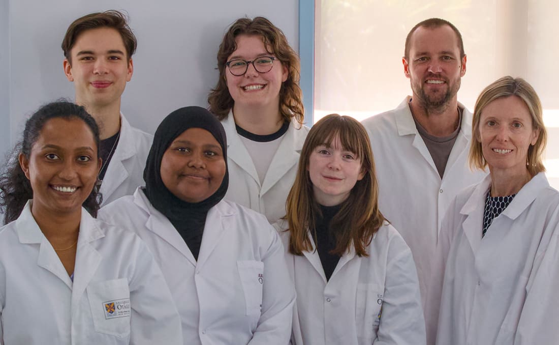 Tina Summerfield and students wearing white coats
