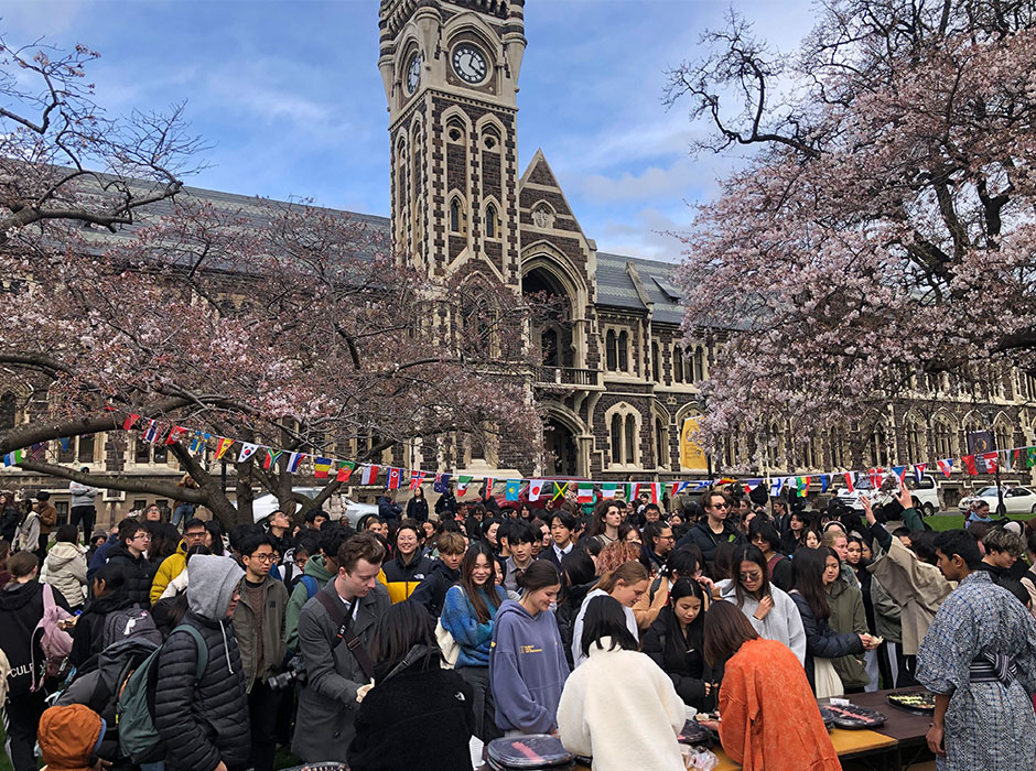 A large crowd of people queueing for sushi 