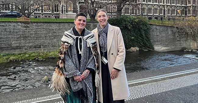 two women standing next to the Leith