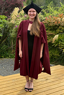 a woman wearing doctoral graduation attire 