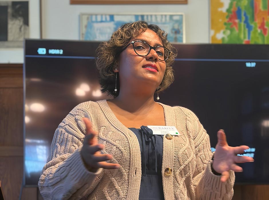 A woman presenting at a symposium